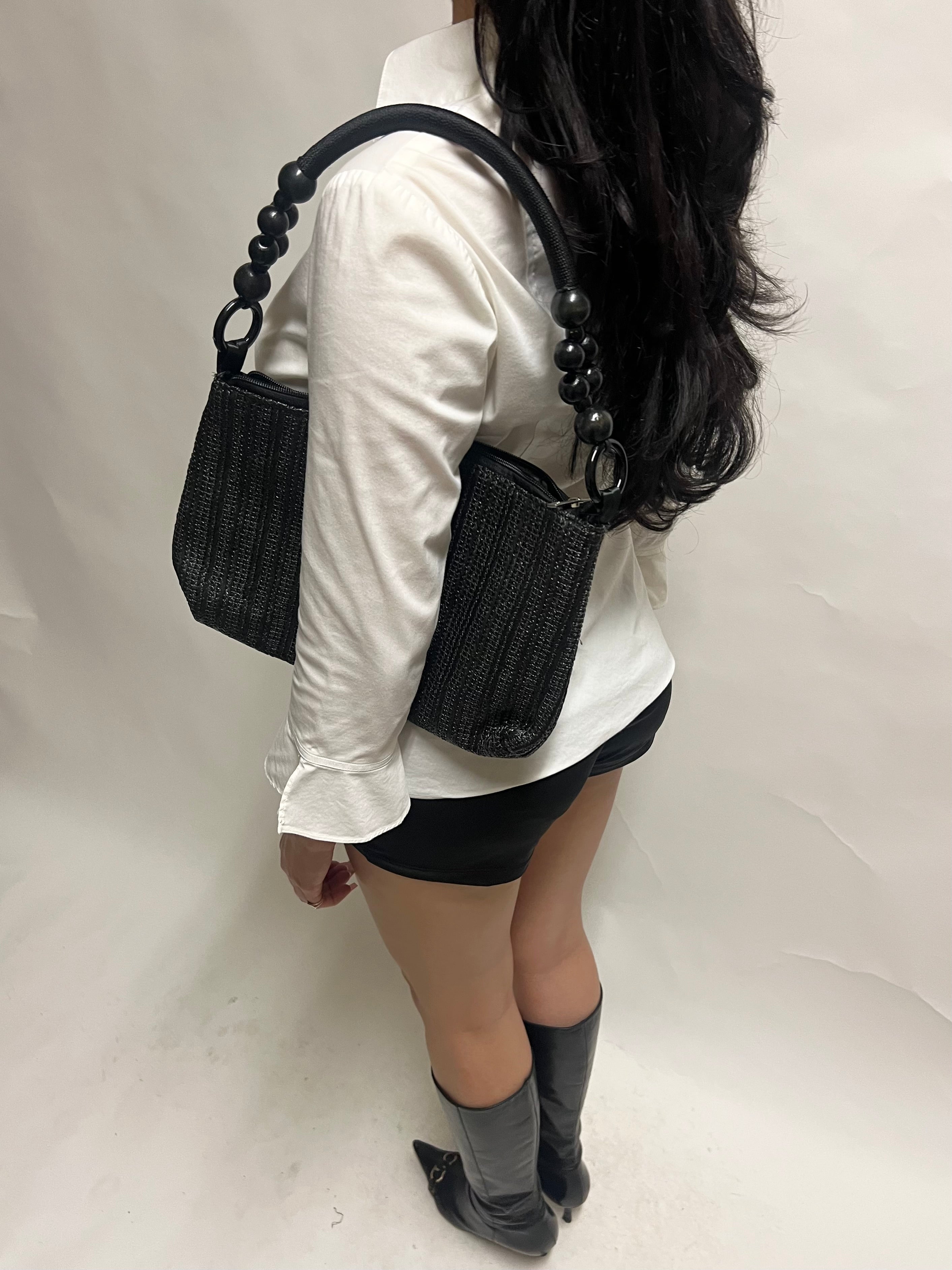 Black beaded handle woven bag