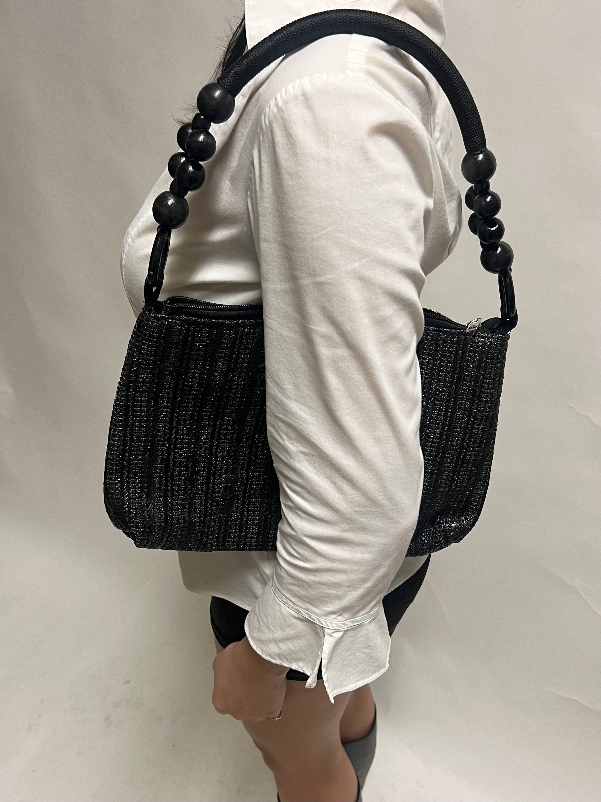 Black beaded handle woven bag