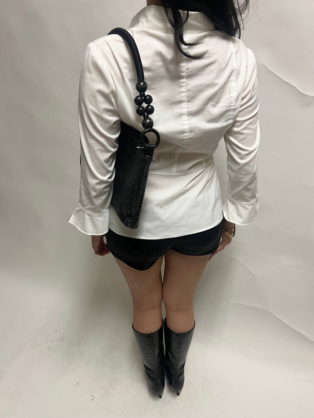 Black beaded handle woven bag